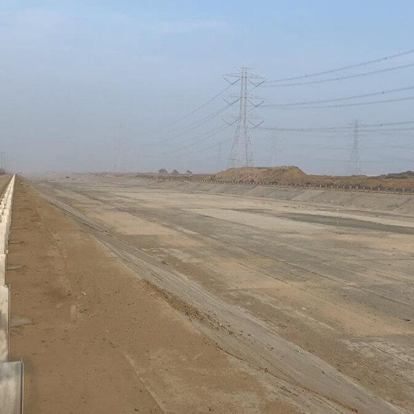 A large dirt area on a cloudy day