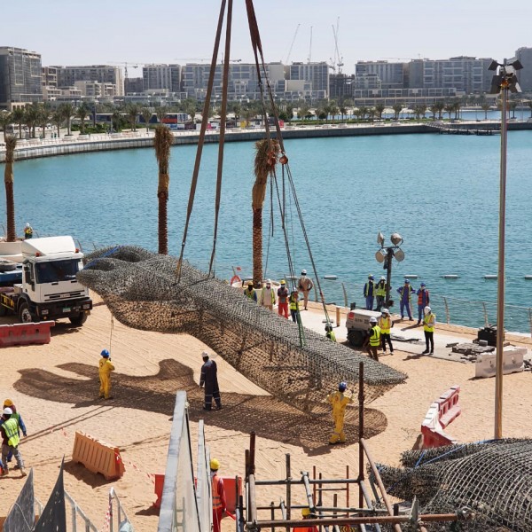 Workers working on The Giant Sculpture at the Yas Bay Waterfront Development in Abu Dhabi.