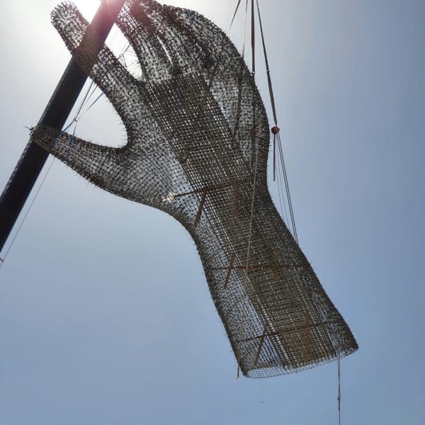 Giant Sculpture hand being held in the air