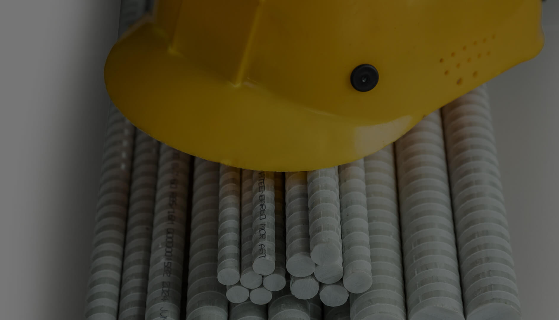 A construction hat on bars of fiberglass rebar