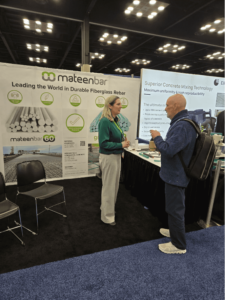 Two people talking at the Mateenbar booth at The Precast Show 2025.