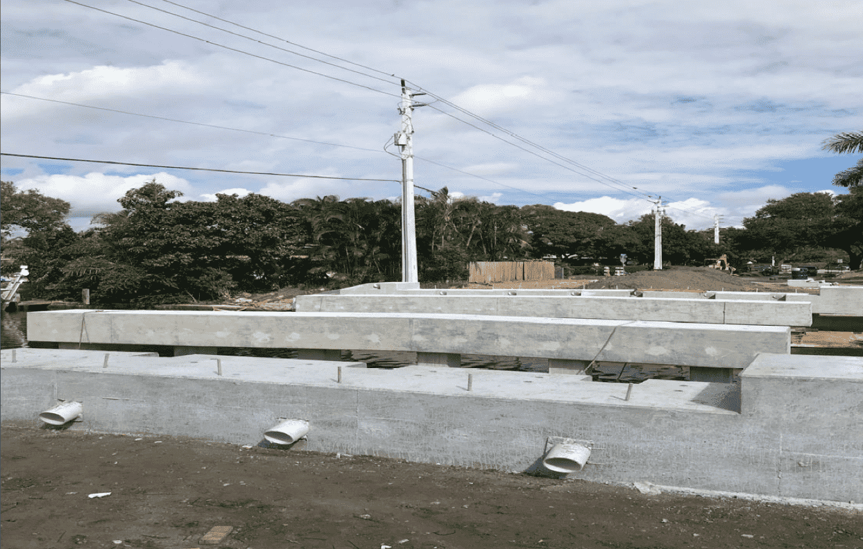A half-built bridge on a partly cloudy day